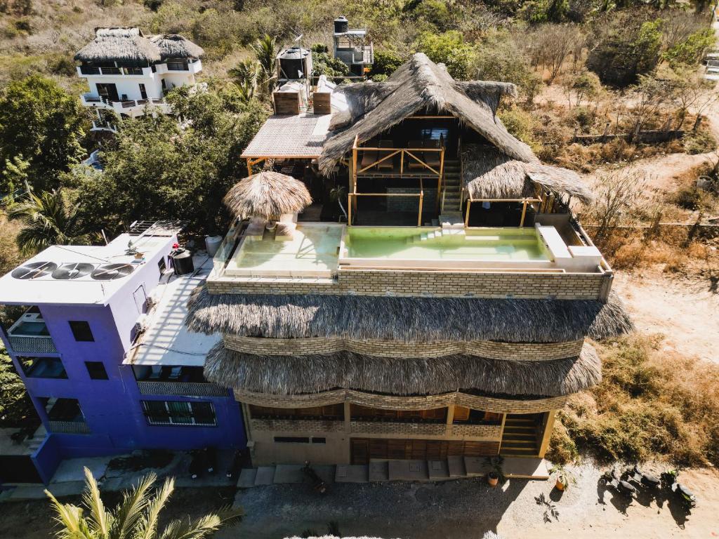 an overhead view of a building with a thatch roof at Villa Macarena Apartamentos Boutique - Adults Only in Puerto Escondido