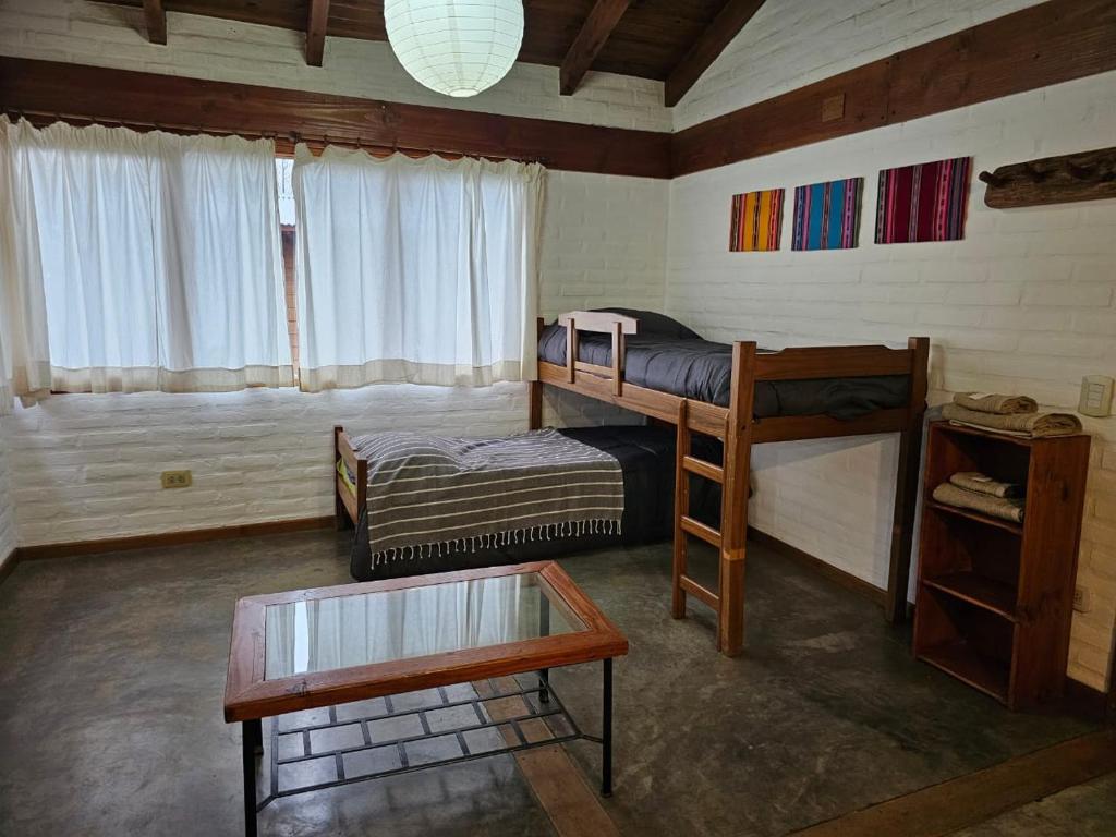 Postel nebo postele na pokoji v ubytování Punto Sur Cabañas