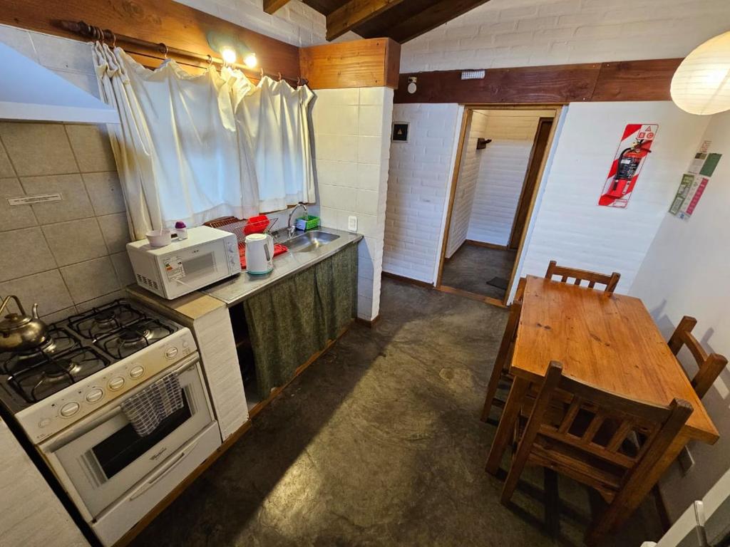 Kuchyň nebo kuchyňský kout v ubytování Punto Sur Cabañas