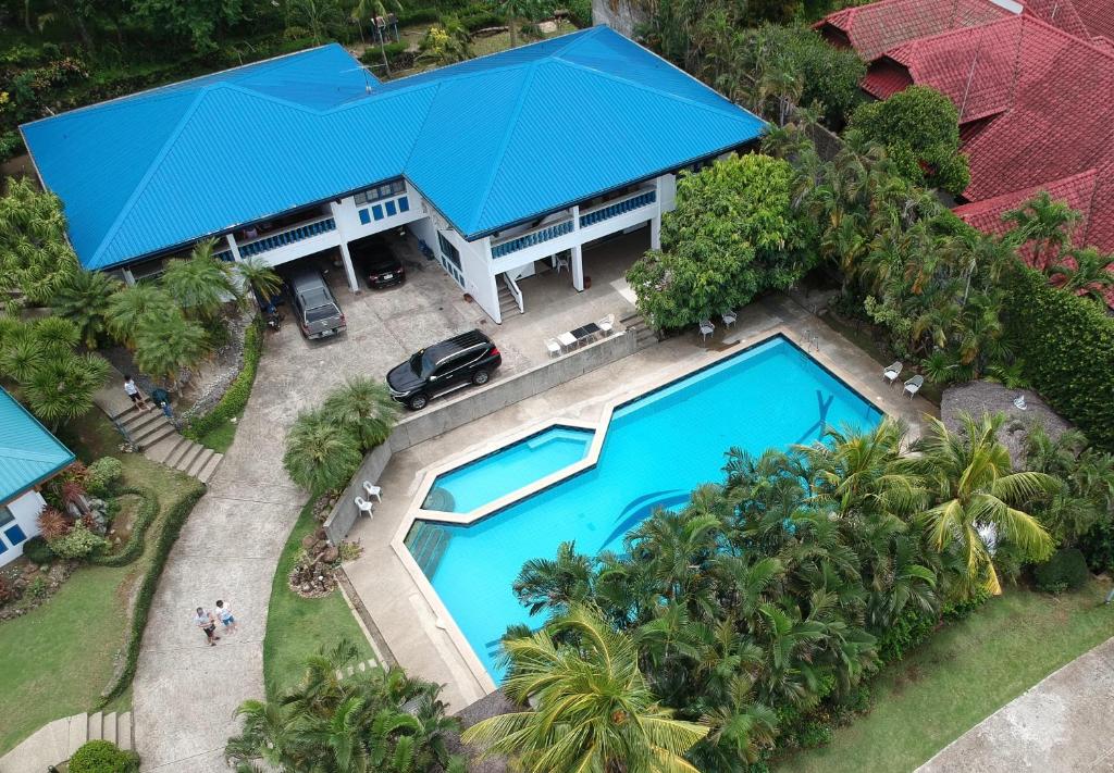 an aerial view of a house with a swimming pool at Casa Las Brisas, Puerto Azul in Ternate