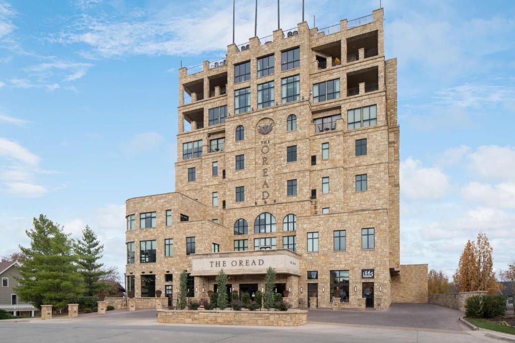 a tall brick building with a sign on it at The Oread Lawrence, Tapestry Collection by Hilton in Lawrence