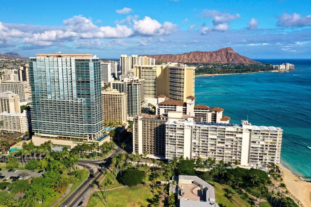 an aerial view of a city and the ocean at Ka La'i Waikiki Beach, LXR Hotels & Resorts in Honolulu