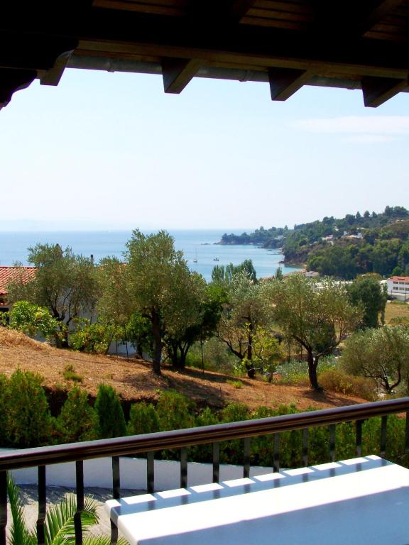 a view of the ocean from a balcony at Villa Anna Maria in Agia Paraskevi
