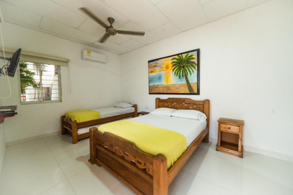Postel nebo postele na pokoji v ubytování Hostal del Mar - Tolu