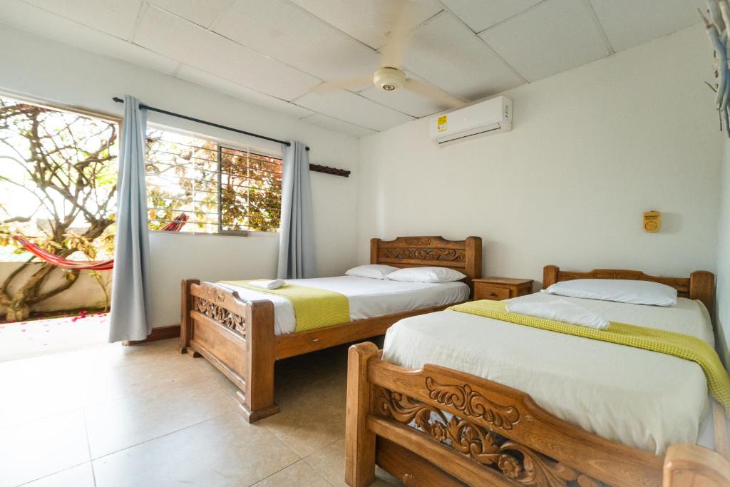 Postel nebo postele na pokoji v ubytování Hostal del Mar - Tolu