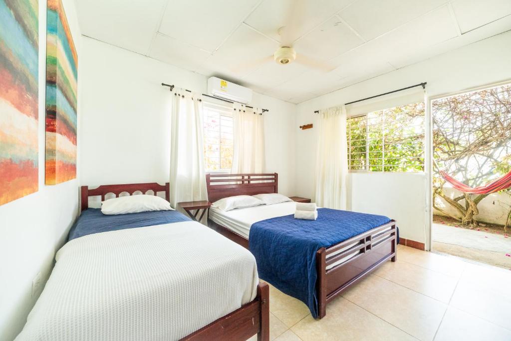Postel nebo postele na pokoji v ubytování Hostal del Mar - Tolu