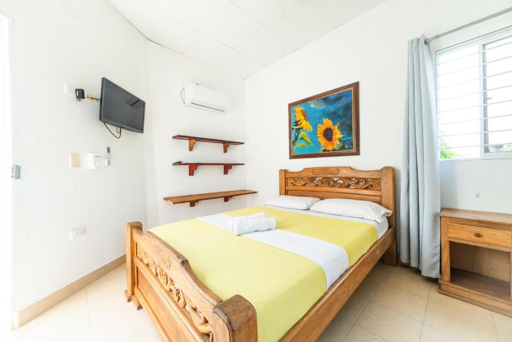 Postel nebo postele na pokoji v ubytování Hostal del Mar - Tolu