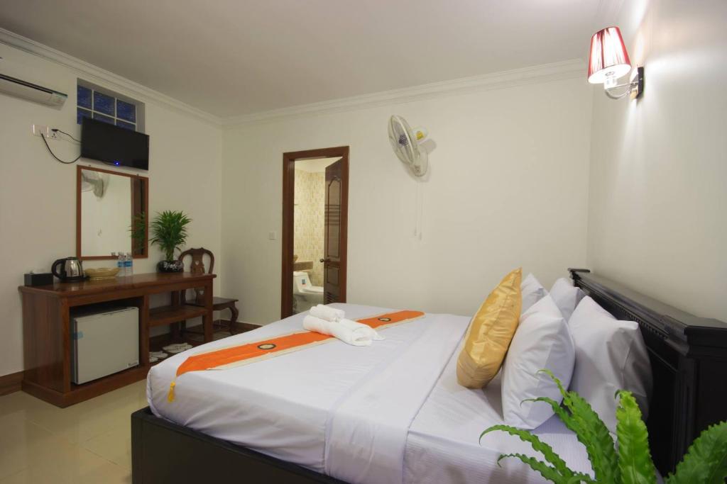 Postel nebo postele na pokoji v ubytování Bou Phanith Villa