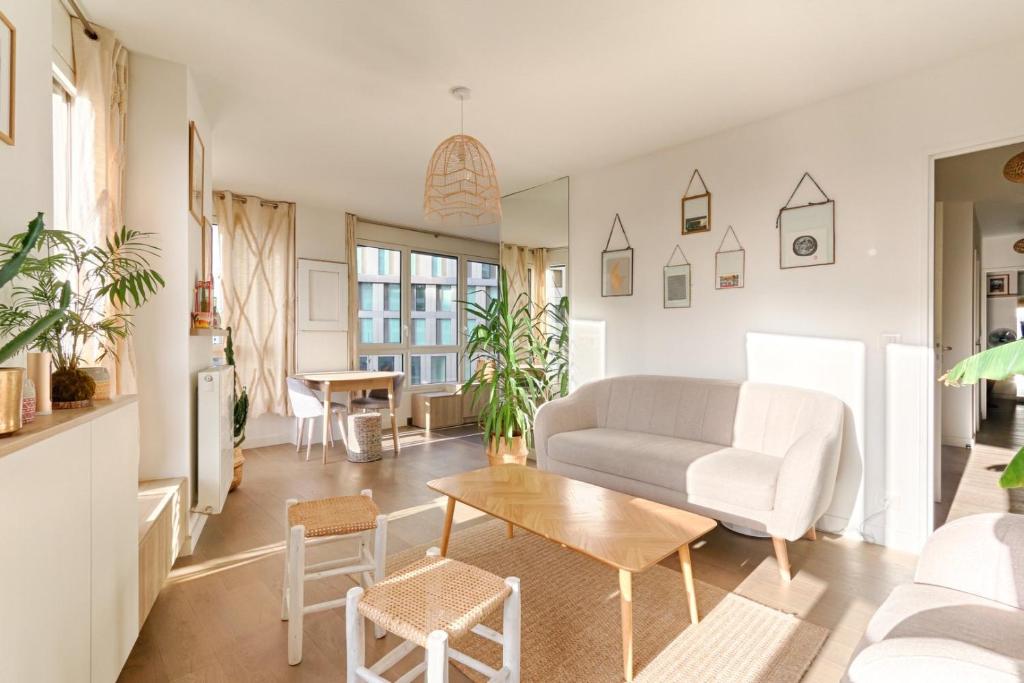 a living room with a couch and a table at Résidor - Beautiful appartment 2P in Paris