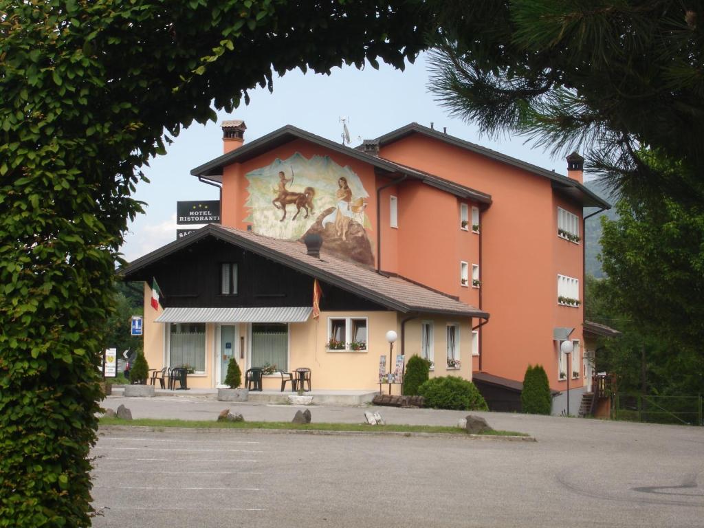 a building with a painting on the side of it at Hotel Ristorante Sagittario in Feltre