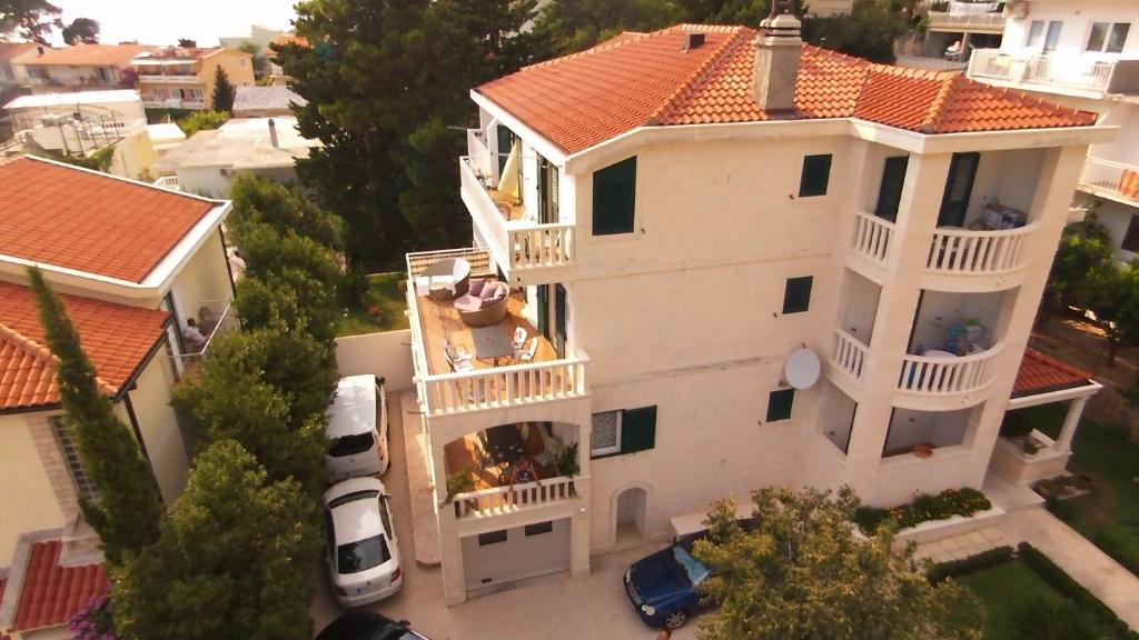 an aerial view of a white house with a balcony at Guest house Villa Ana in Baška Voda