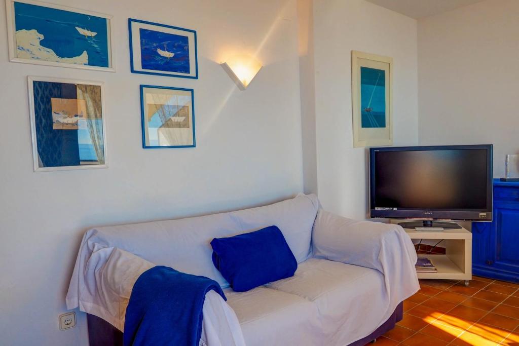 A television and/or entertainment centre at Amazing Seaview Apartment by Hello Homes Sitges