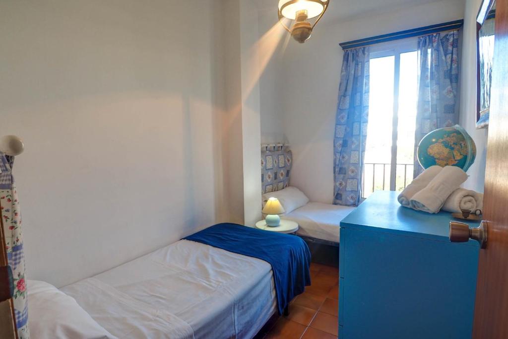 A bed or beds in a room at Amazing Seaview Apartment by Hello Homes Sitges