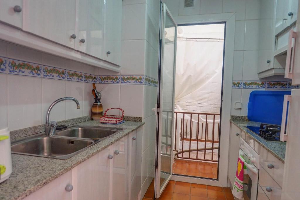 A kitchen or kitchenette at Amazing Seaview Apartment by Hello Homes Sitges