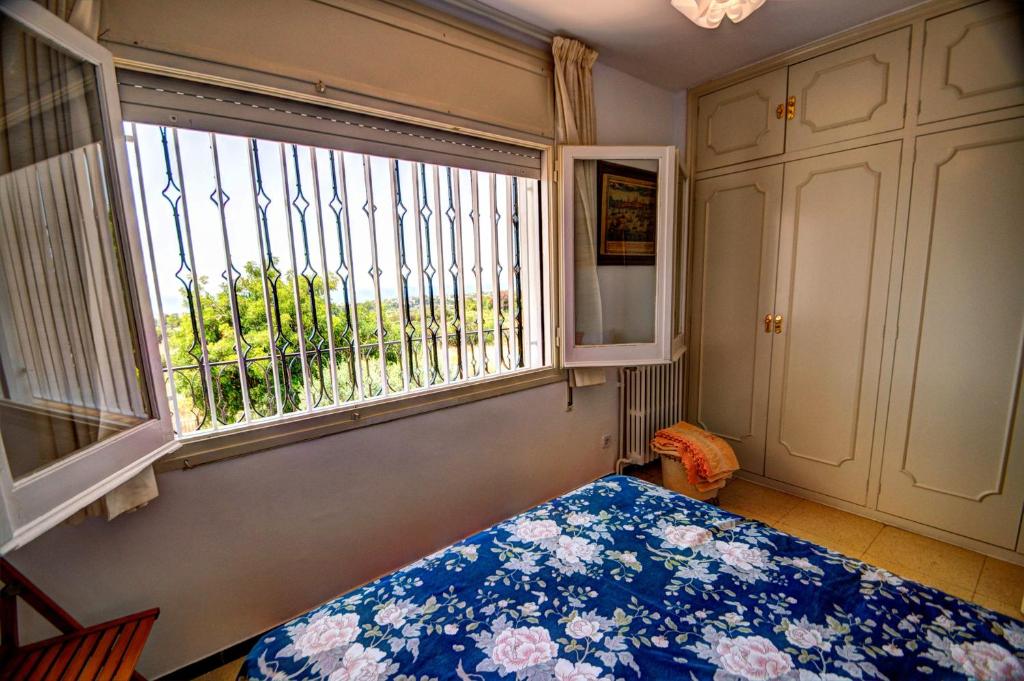 A bed or beds in a room at Can Ferran by Hello Homes Sitges
