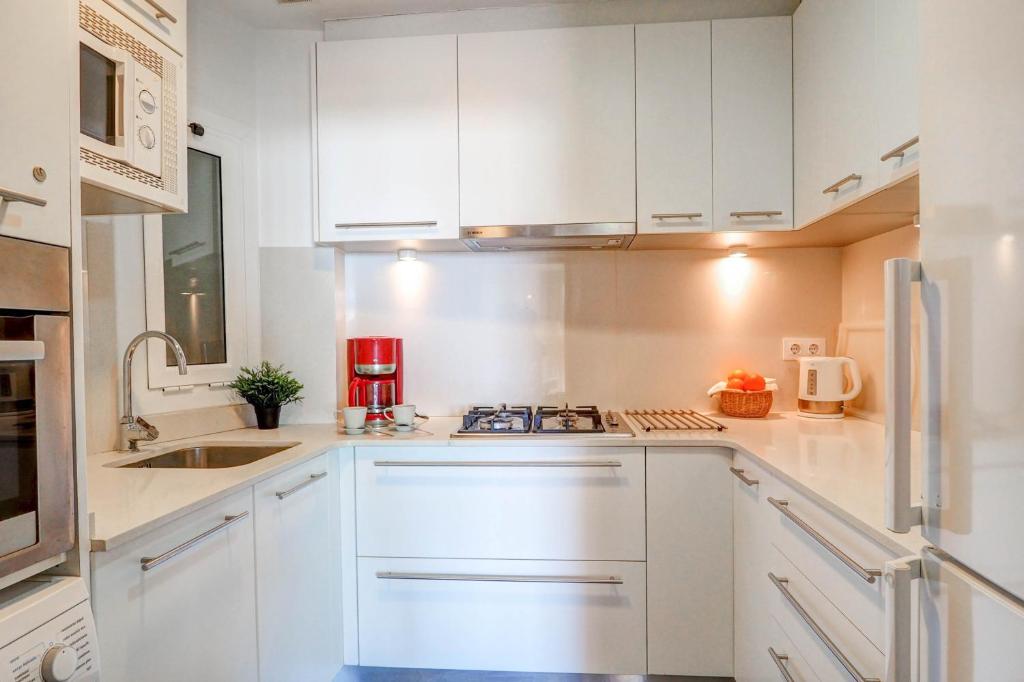 A kitchen or kitchenette at La Gioia 1 by Hello Homes Sitges