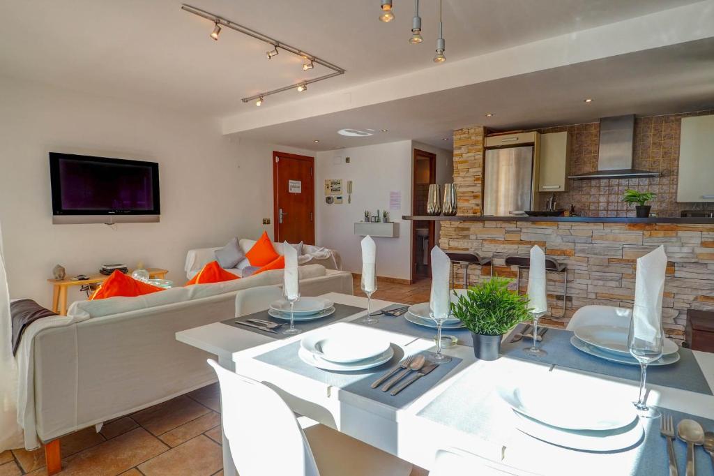 A television and/or entertainment centre at La Marina Sea Front by Hello Homes Sitges