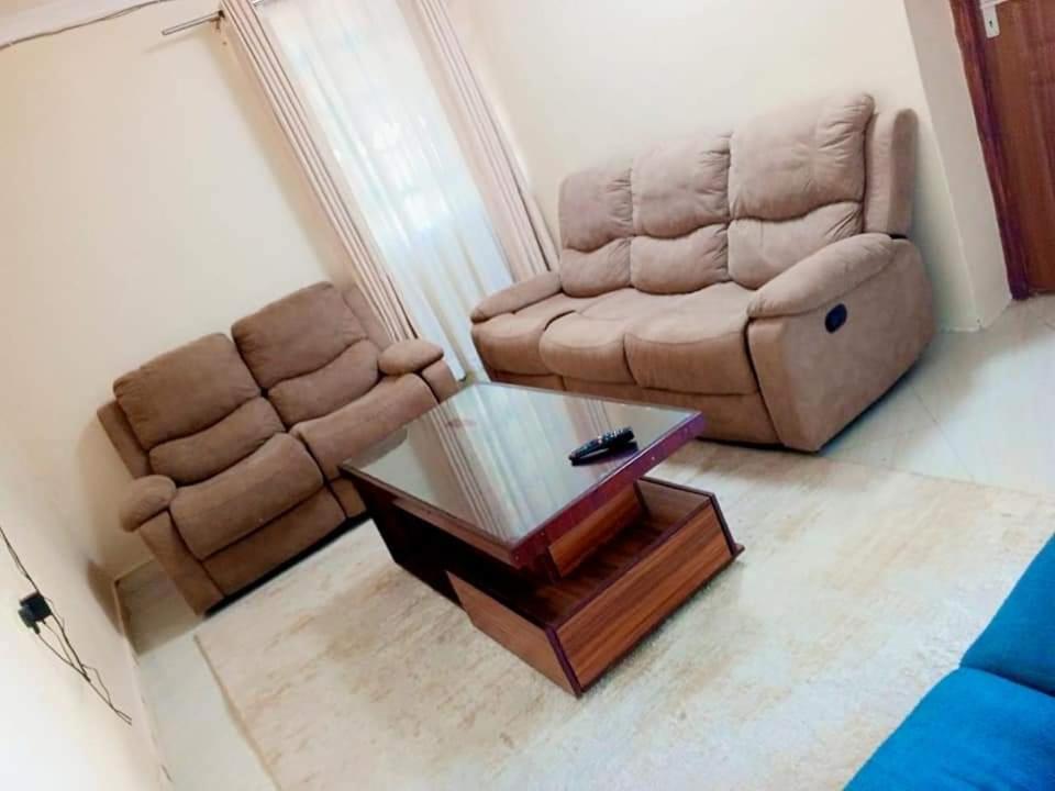 a living room with a couch and a coffee table at Pavleena Residence 2 Bedrooms unit in Nanyuki