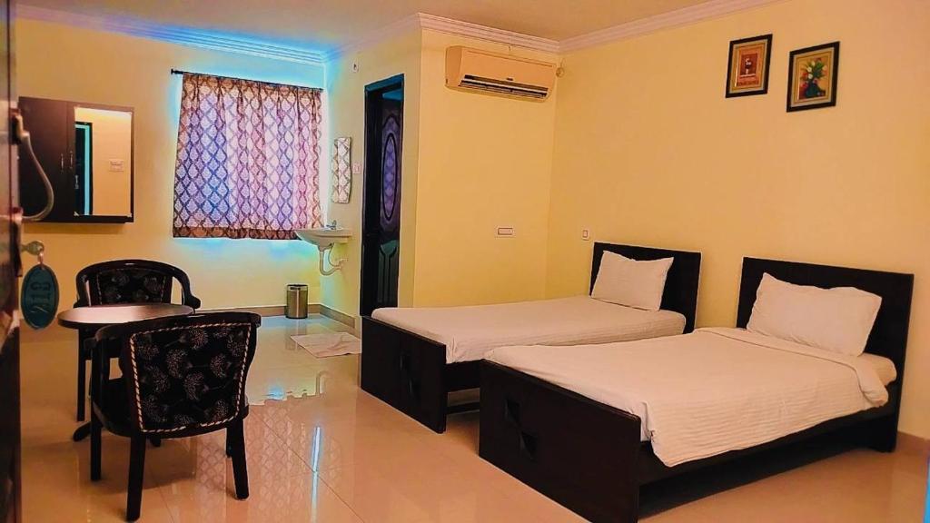 Voodi või voodid majutusasutuse Hotel Nawab's toas