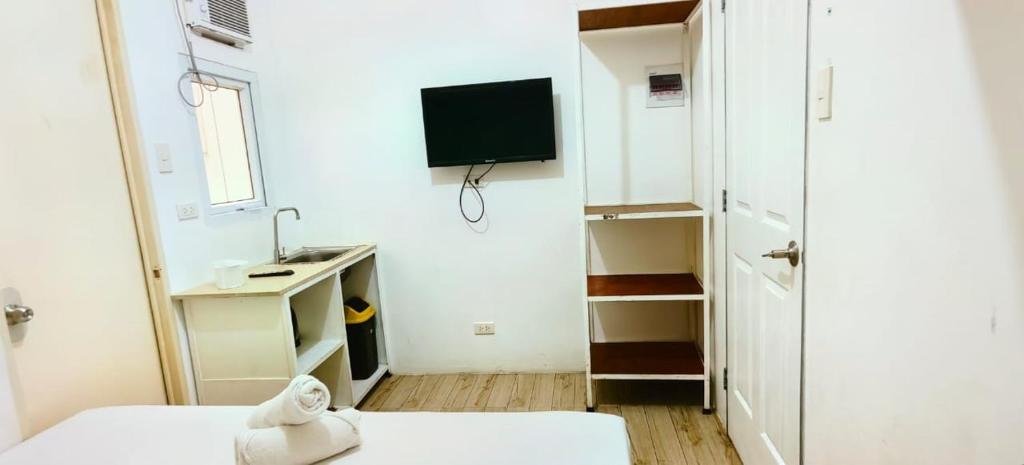 TV a/nebo společenská místnost v ubytování Pasay Centrale Hotel