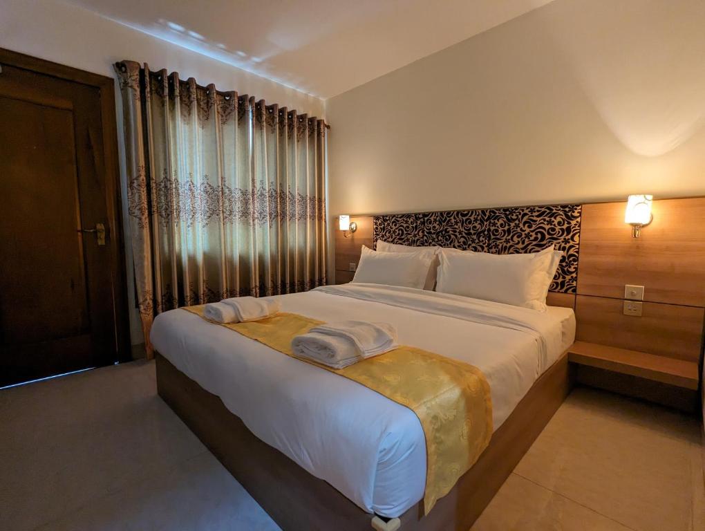 Postel nebo postele na pokoji v ubytování 中青秋果酒店 True Go Hotel