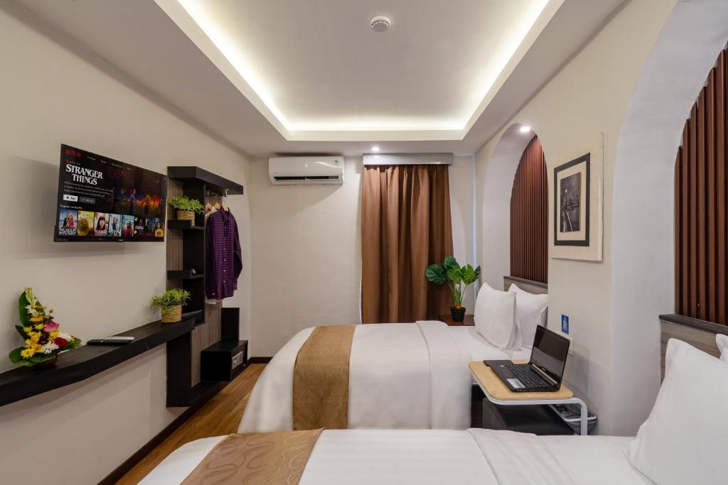 TV a/nebo společenská místnost v ubytování Everyday Hotel Kuta Central