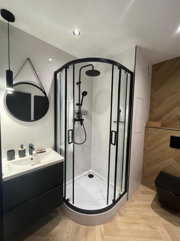 a bathroom with a shower and a sink at APARTMÁN STYLE Brezno in Brezno