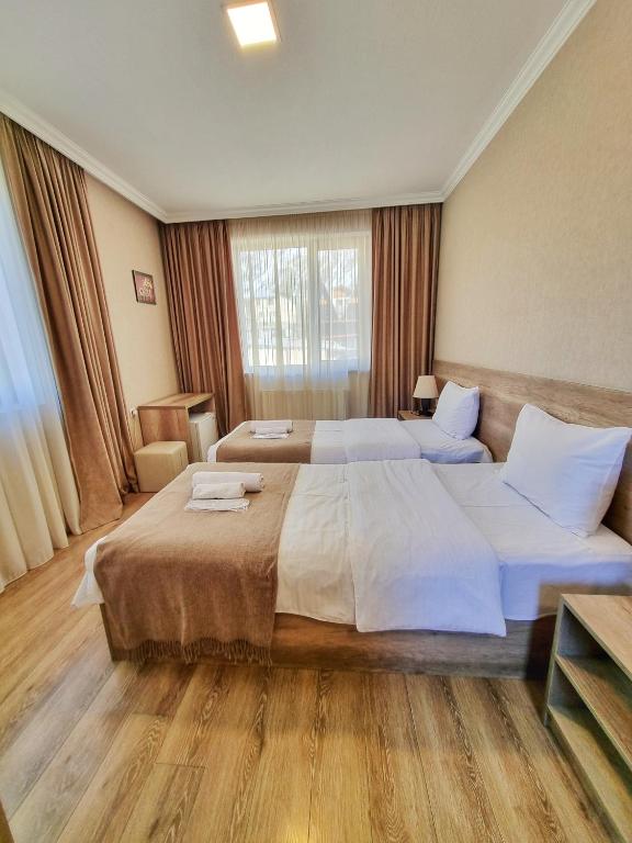 Voodi või voodid majutusasutuse Sunshine Kazbegi toas