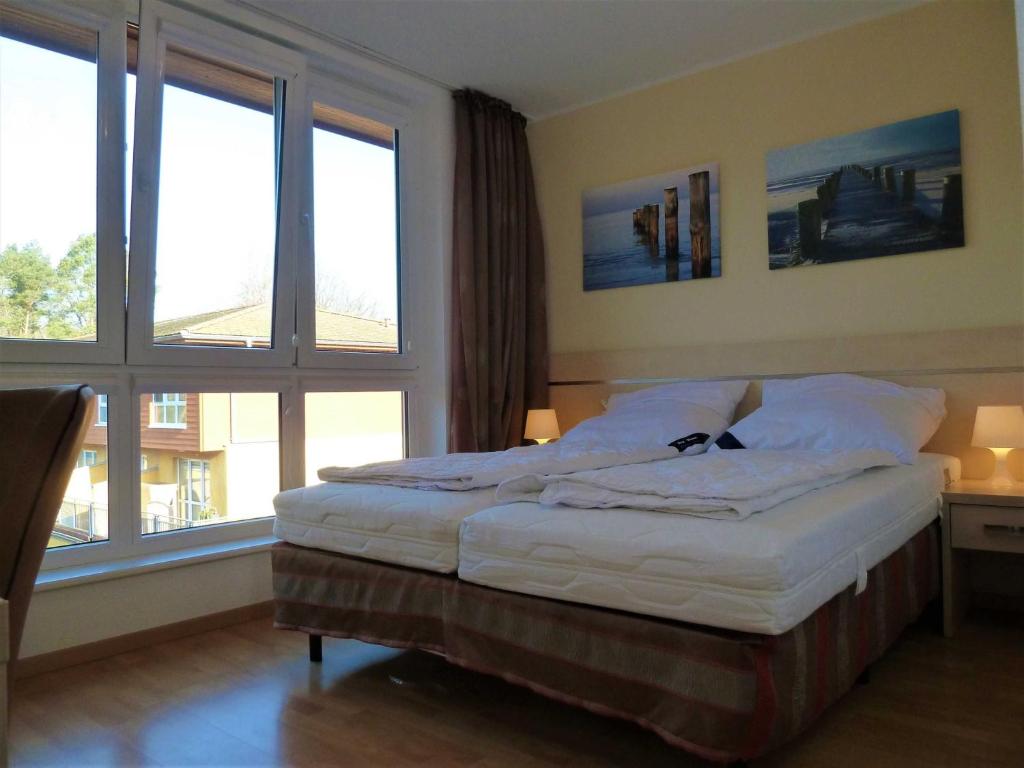 Postel nebo postele na pokoji v ubytování Zempin Ostseepark WE 32 Insel Used