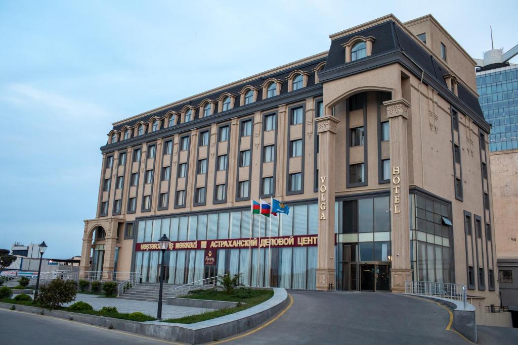 a large building with a street in front of it at Volga Hotel Baku in Baku