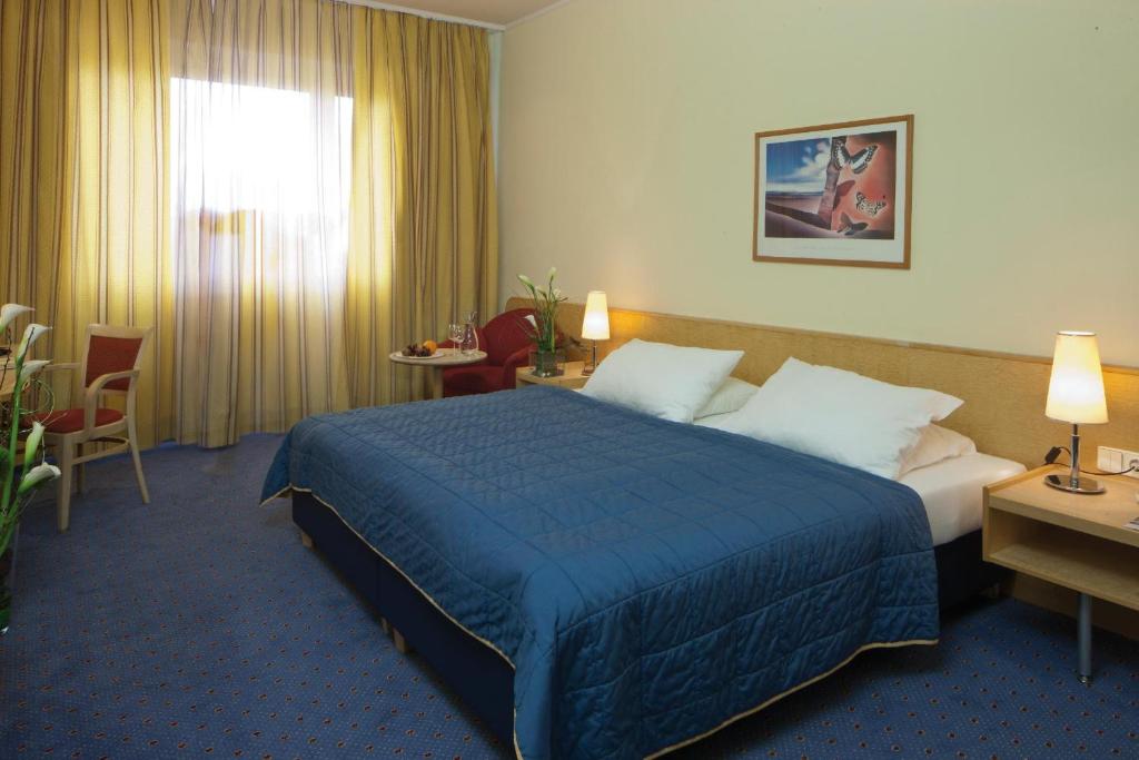Postel nebo postele na pokoji v ubytování Austria Trend Hotel Europa Salzburg