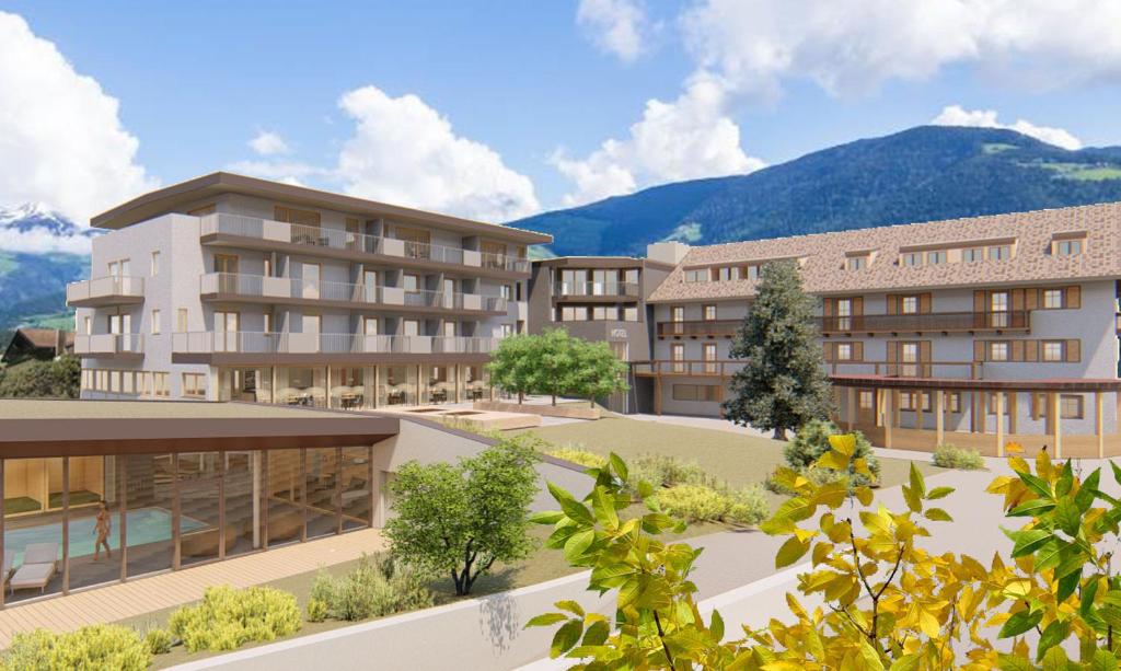 a rendering of a building with mountains in the background at Hotel Langhof in Natz-Schabs