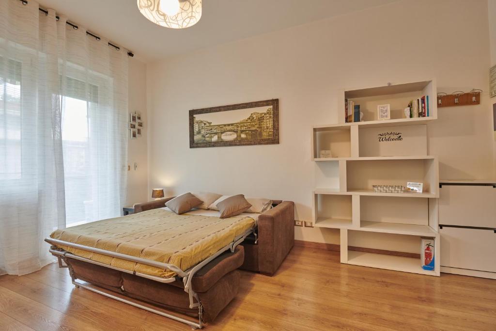 Posteľ alebo postele v izbe v ubytovaní Casa Gordigiani - bilocali con parcheggio