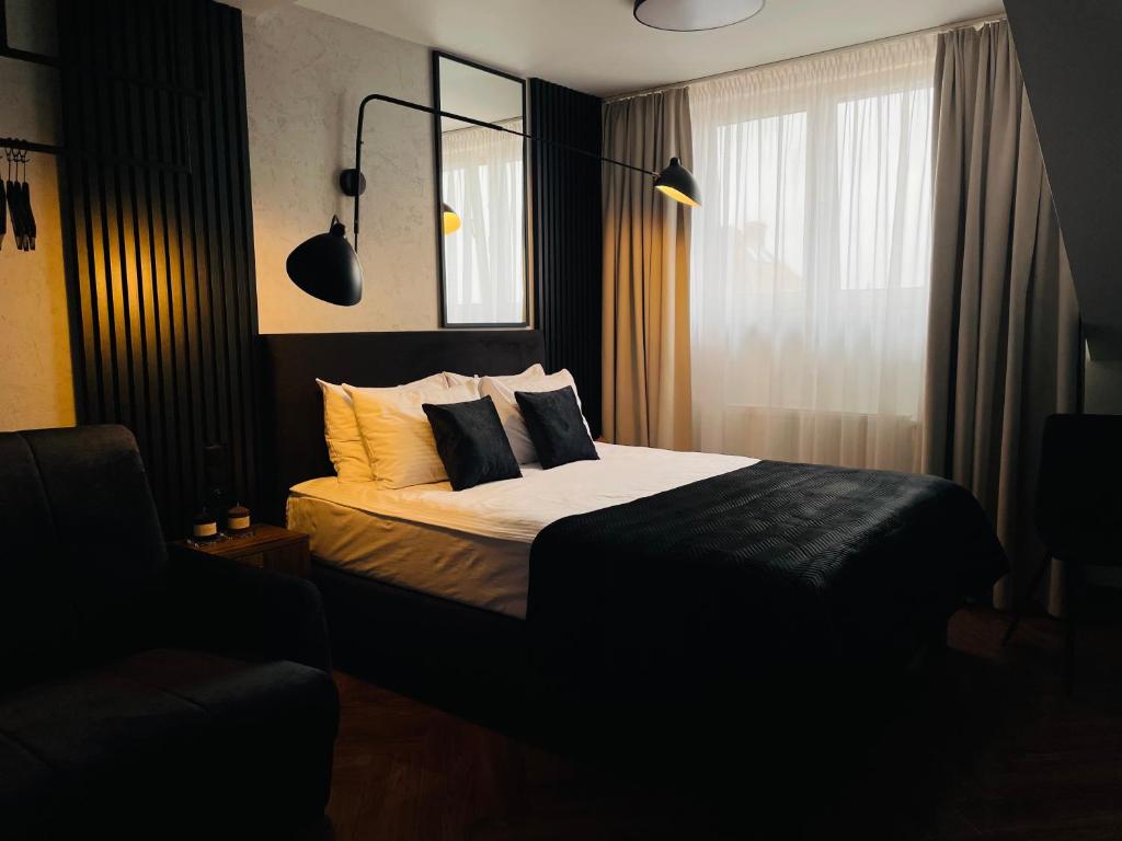 Postel nebo postele na pokoji v ubytování Hotel Millennium