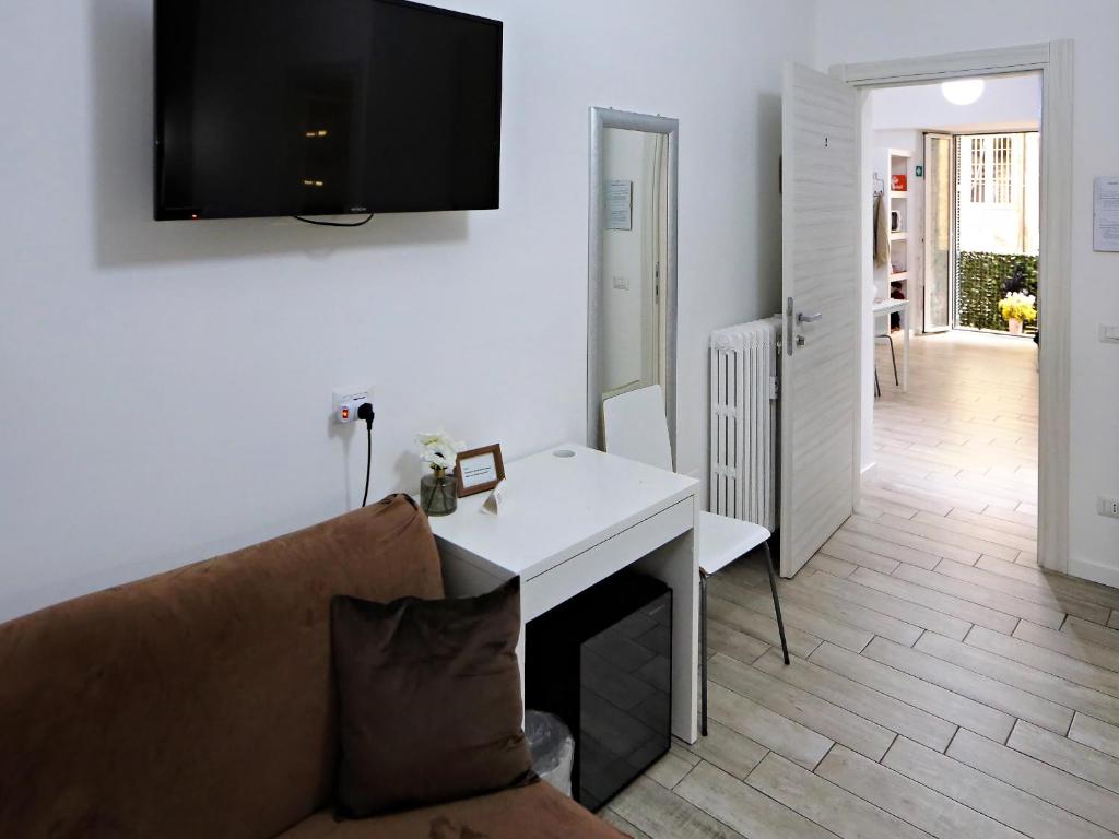 TV a/nebo společenská místnost v ubytování Relais Villa Borghese