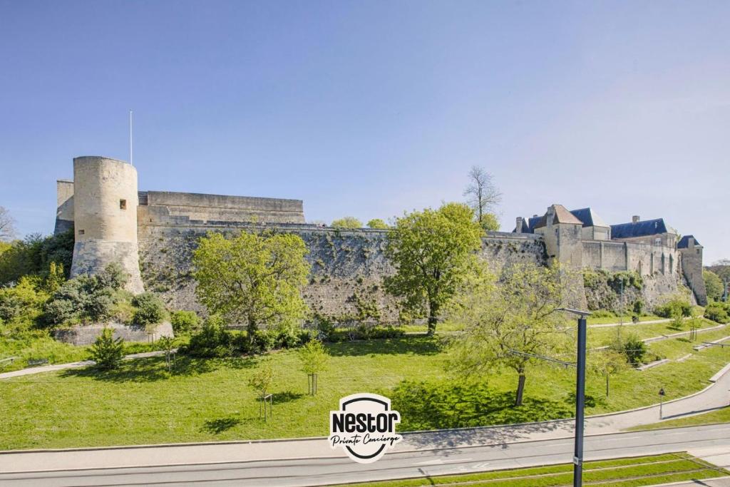 a view of the ruins of a castle at La Casa Will - Family flat for 8 in Hérouville-Saint-Clair