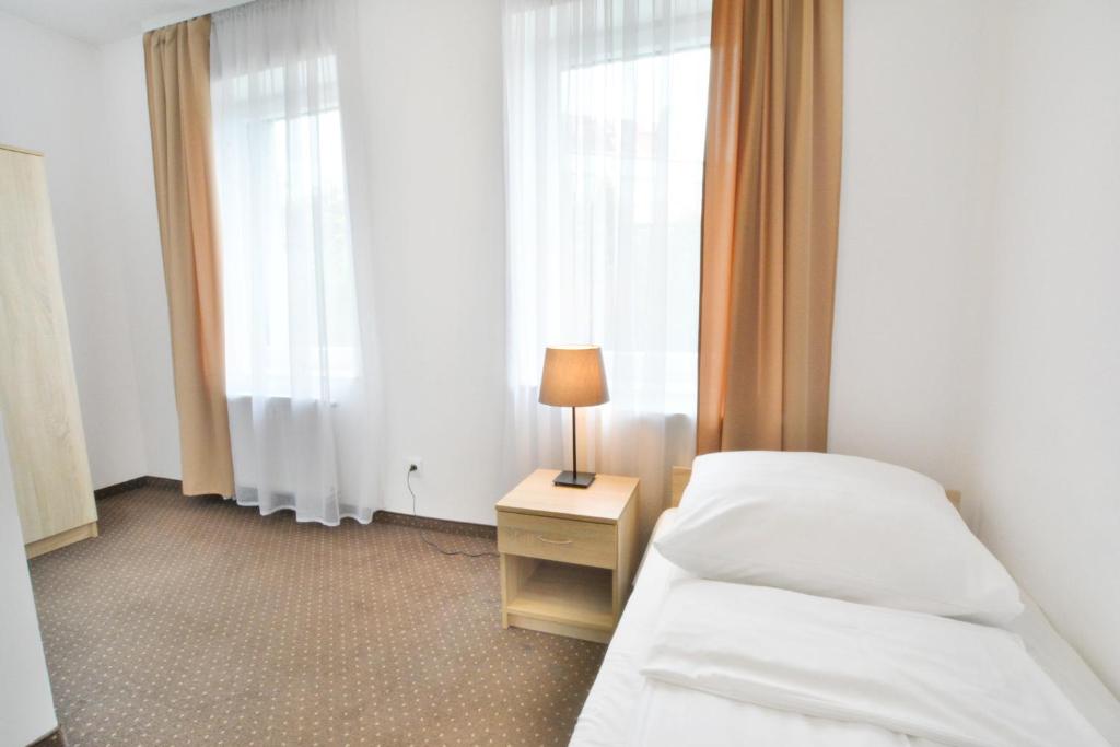 Postel nebo postele na pokoji v ubytování Pokoje 4you Szczecin