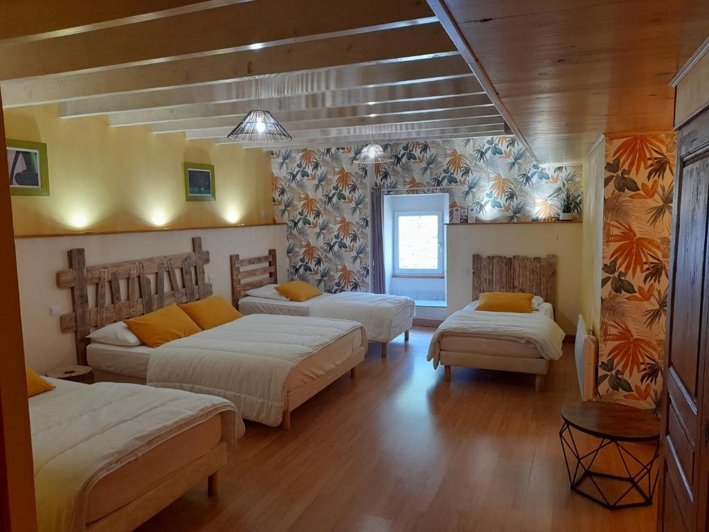 Postel nebo postele na pokoji v ubytování Les Chambres d'Hôtes Le Triskèle