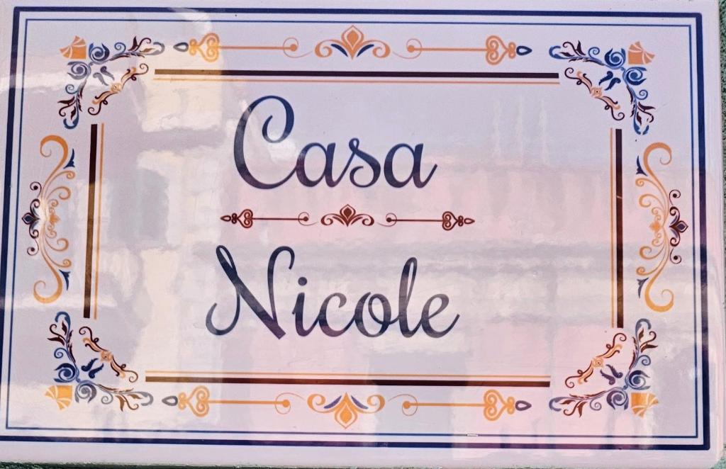 a sign with the words casa niele at Casa Nicole - Letojanni Taormina in Letojanni