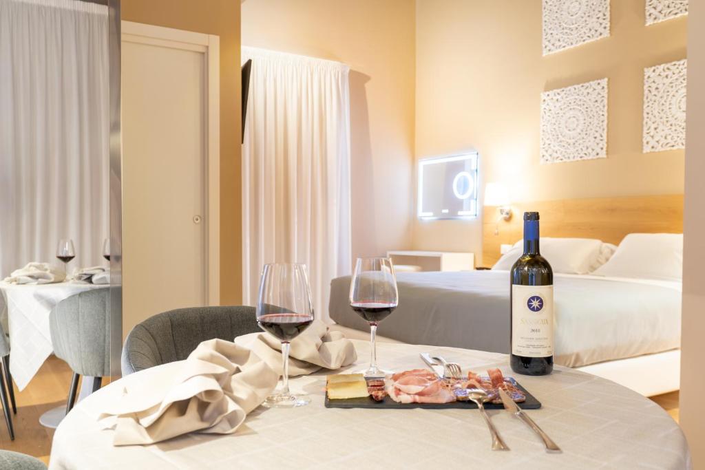 Postel nebo postele na pokoji v ubytování GG8 Hotel & Suite SPA