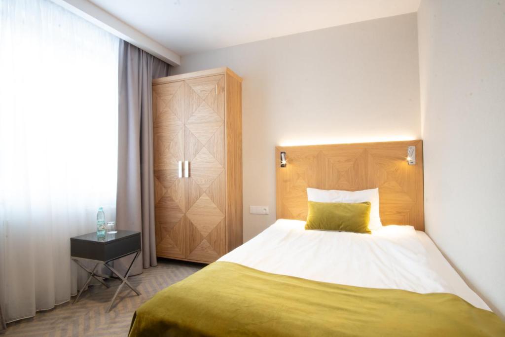 Posteľ alebo postele v izbe v ubytovaní Hotel Impresja