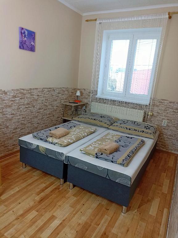 Postel nebo postele na pokoji v ubytování Abturist penzion