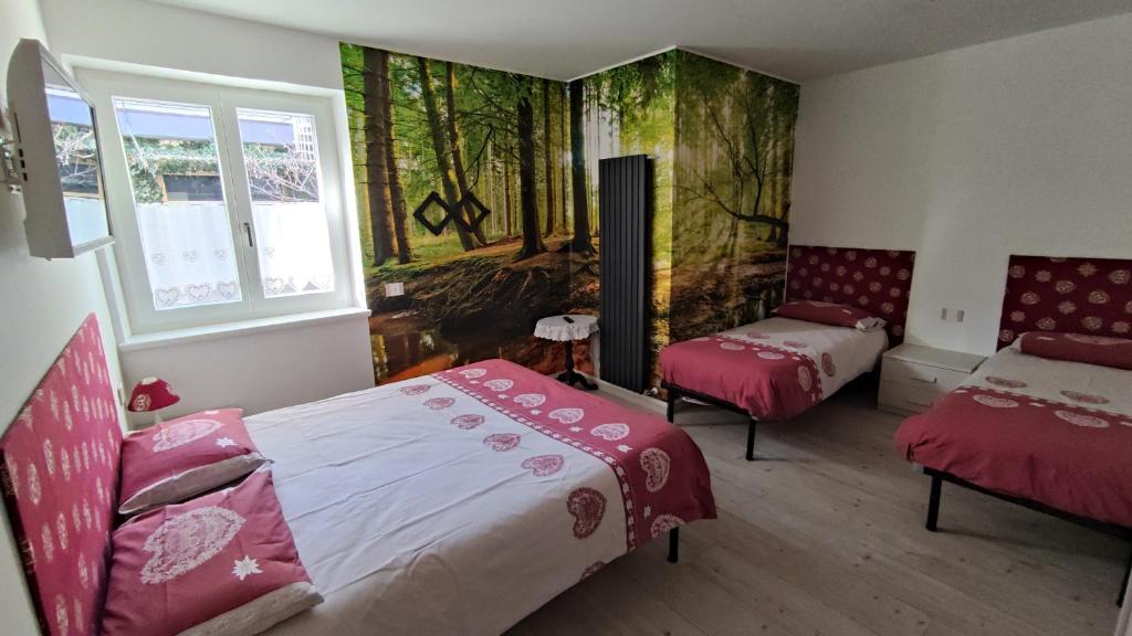 Postel nebo postele na pokoji v ubytování Apartments Giovannini