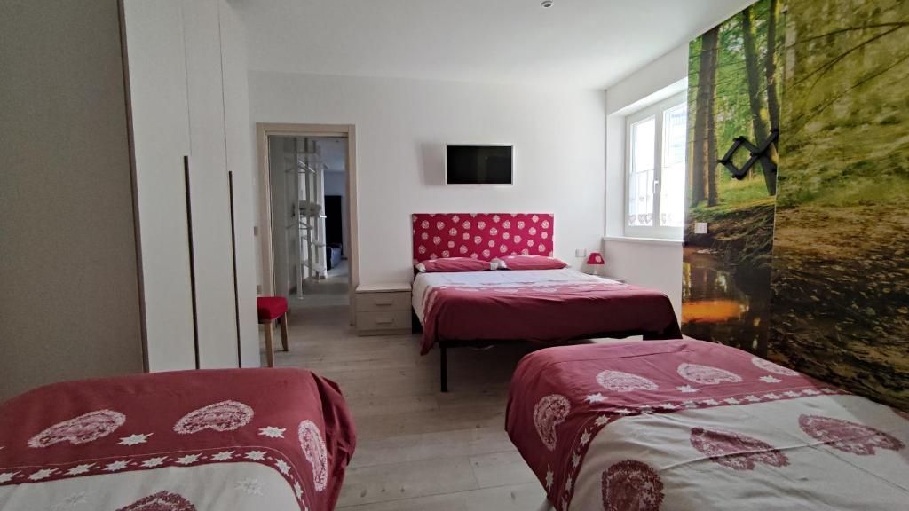 Postel nebo postele na pokoji v ubytování Apartments Giovannini