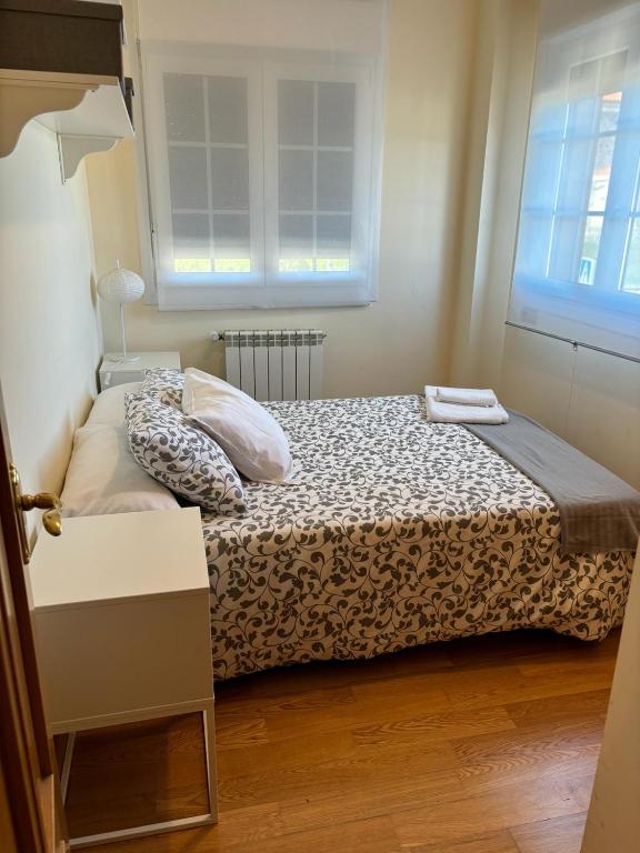 Posteľ alebo postele v izbe v ubytovaní Apartamentos Del Pisuerga