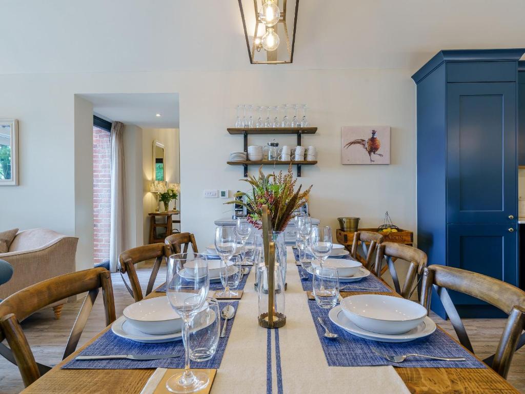 a long table with glasses and plates on it at 2 Pheasant in East Ilsley