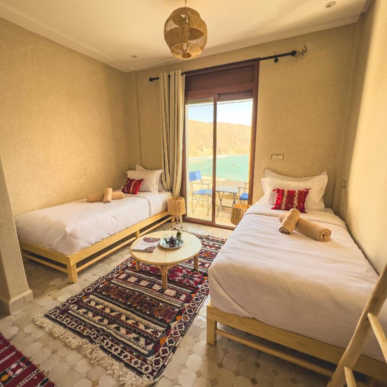 Postel nebo postele na pokoji v ubytování The Moroccan Surf House