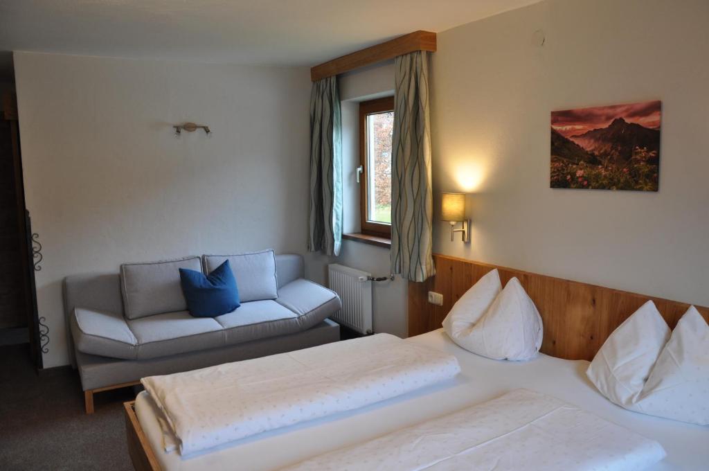 Postel nebo postele na pokoji v ubytování Berghof