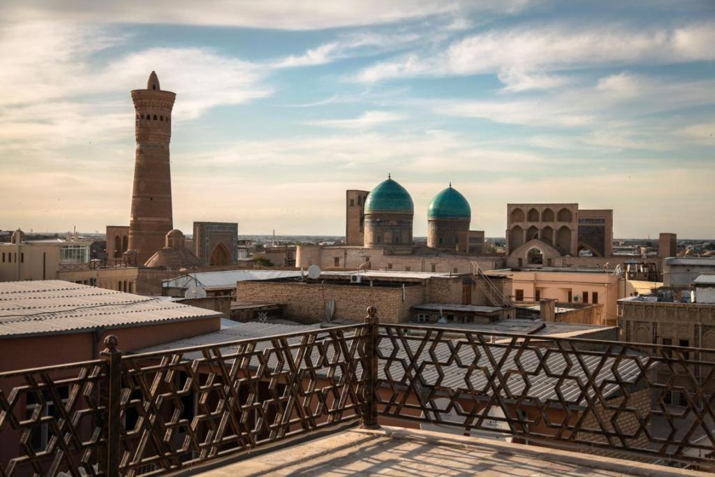 a view of a city from a balcony at Hotel in Bukhara