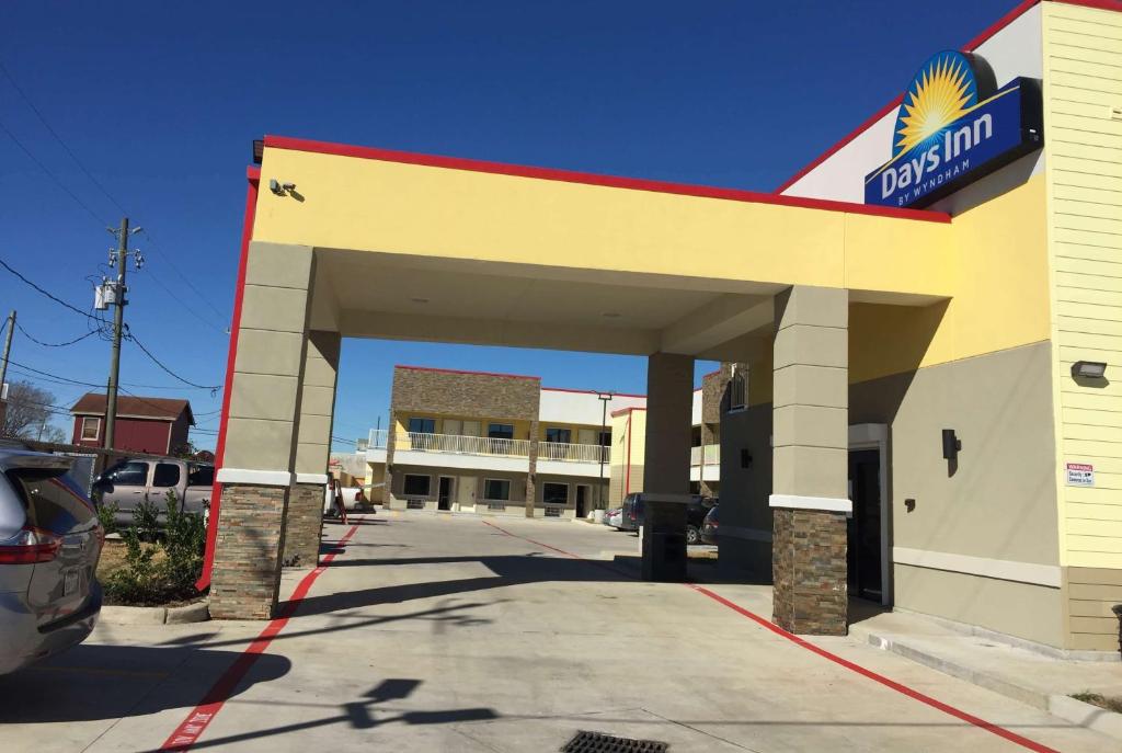 a mobil gas station in a parking lot at Days Inn by Wyndham Freeport in Freeport
